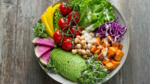 Two raw food plates with plant based ingredients and flexible raw foods arranged side by side without labels